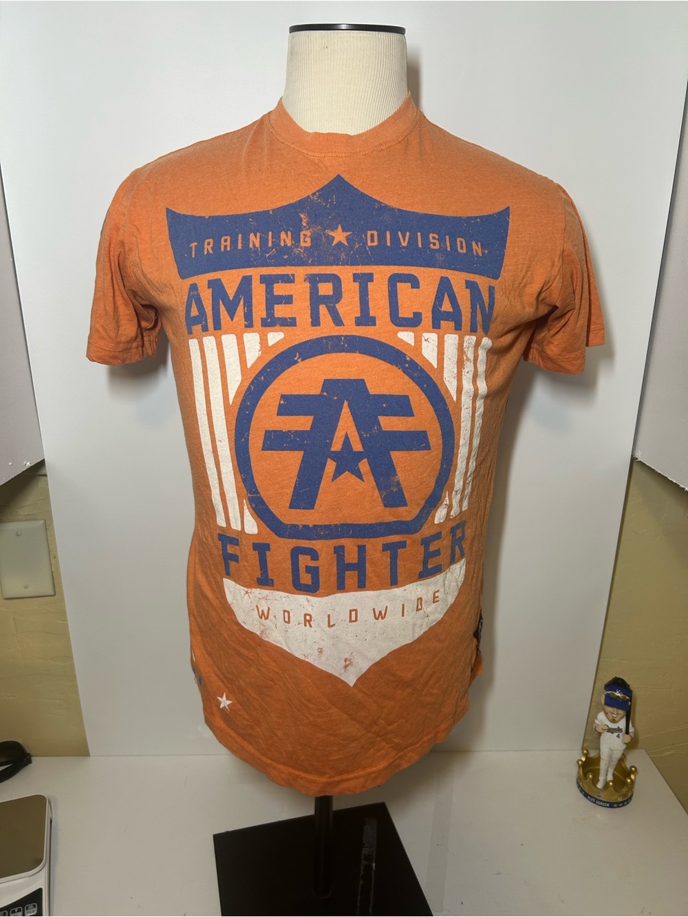 American Fighter Orange Short-Sleeve Graphic Tee with Blue & White Print